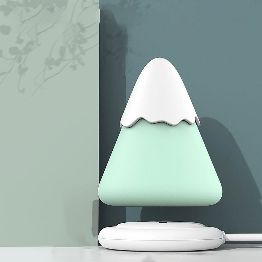 Vibrador Discreto em Silicone Recarregavel 7 Suc��es com LED Colorido Snow Mountain Cyan - vista superior mostrando a boca de succao e o design limpo do produto
