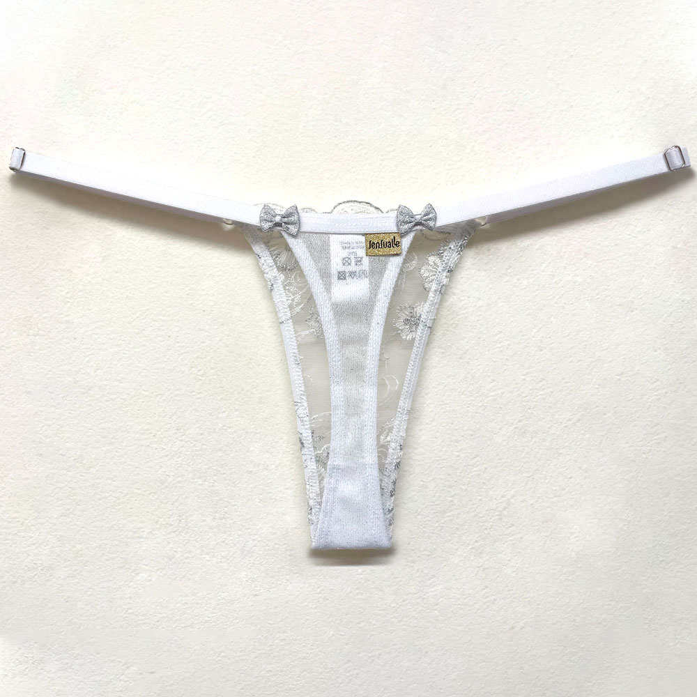 Calcinha String Fio Dental Sensual Sexy em Tule Bordado com Fios Prateados Branca | Vista interna da calcinha esticada, mostrando o forro e etiqueta