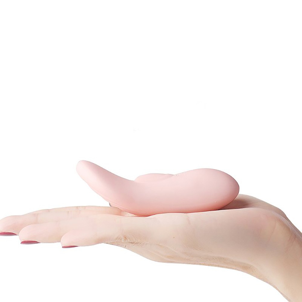 Vibrador para Clit�ris Wing Rosa na palma da m�o, destacando o tamanho compacto e design ergon�mico.
