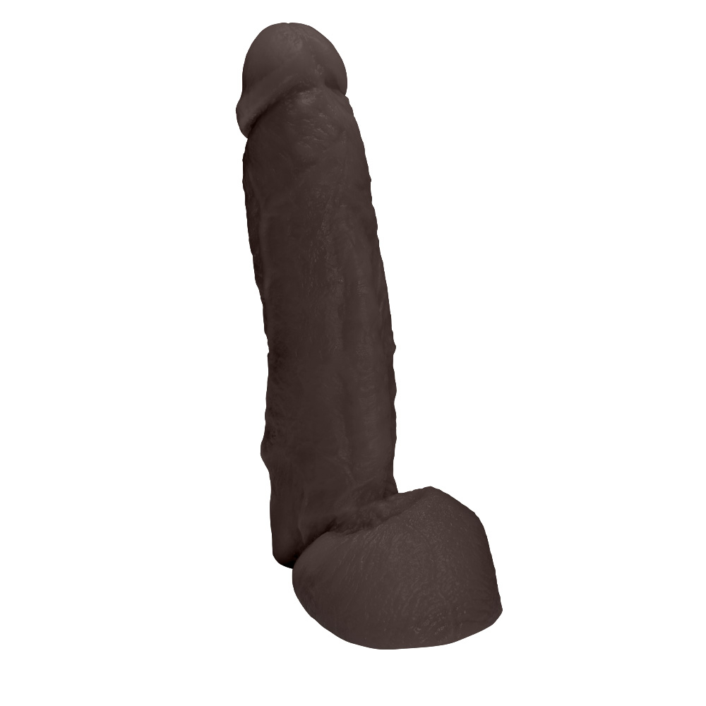 P�nis JeFree em PVC Flex�vel At�xico com Escroto 25 x 6,5cm Marrom em perspectiva, real�ando sua flexibilidade e acabamento.