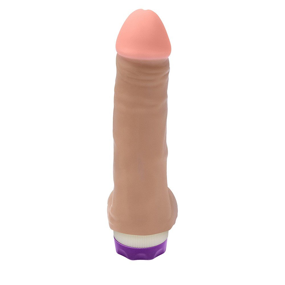 Detalhe da parte superior do P�nis Real�stico com Vibrador HEFESTO, mostrando a ponta em tom rosado e a textura do material PVC Toque Macio.