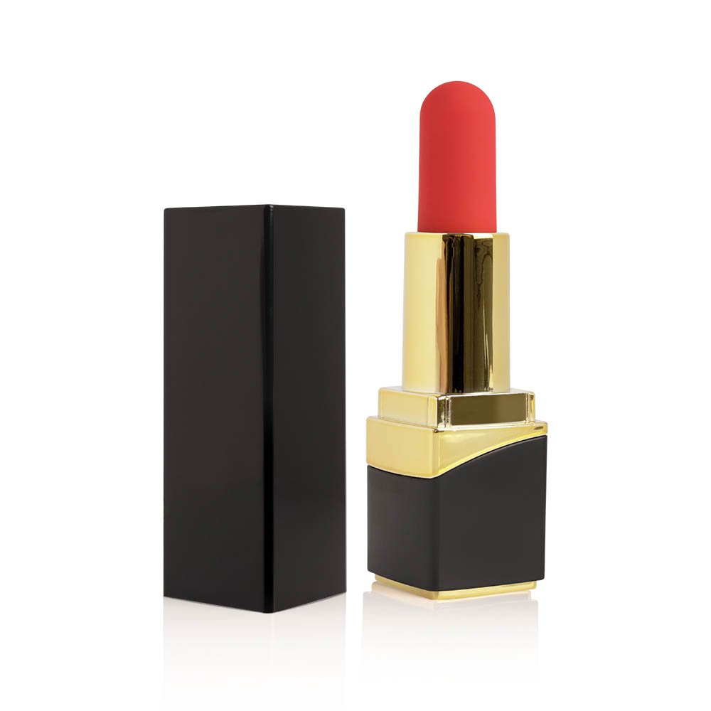 Vibrador e Estimulador Multivelocidade Recarregavel Dona Kiss em formato de batom dourado e vermelho ao lado de sua tampa