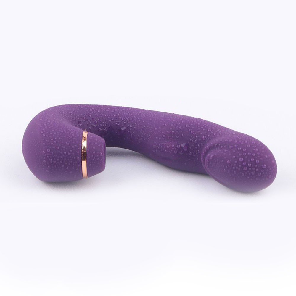 Vibrador Duplo em Silicone Recarregavel Oiga Roxo, vista superior mostrando a textura do silicone com gotas d'agua, indicando ser a prova d'agua.