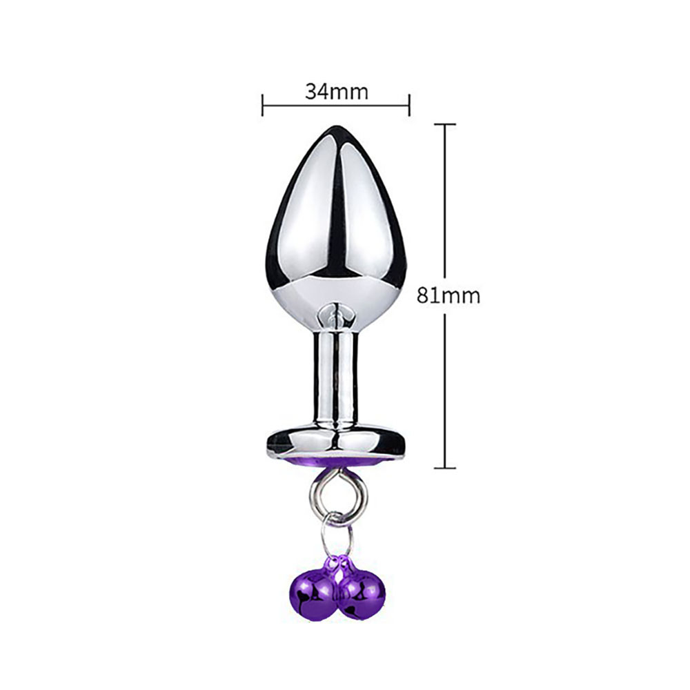 Plug Anal Joia em A�o Inox com cristal roxo e sinos, apresentando medidas em mil�metros: 81mm de comprimento total e 34mm de di�metro m�ximo.