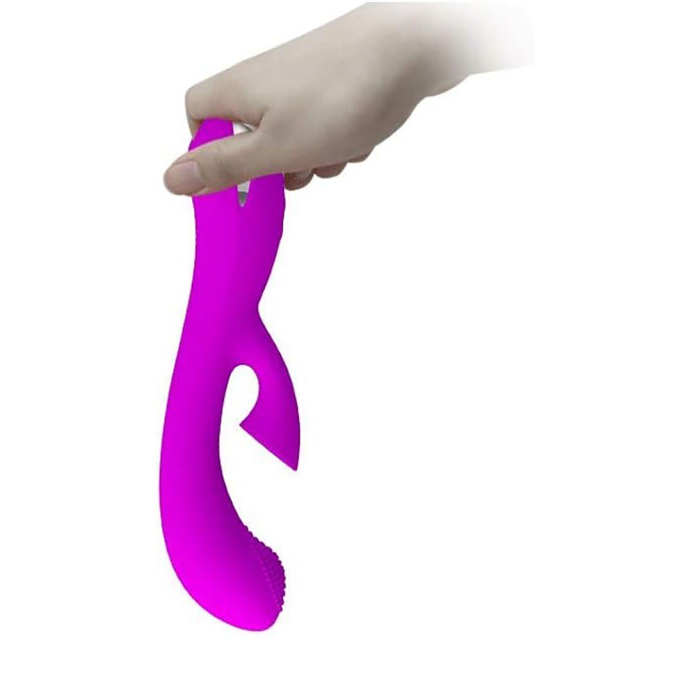 Vibrador Duplo em Silicone Recarreg�vel Roy Pink em detalhe, evidenciando o design para o ponto G e o estimulador de clit�ris