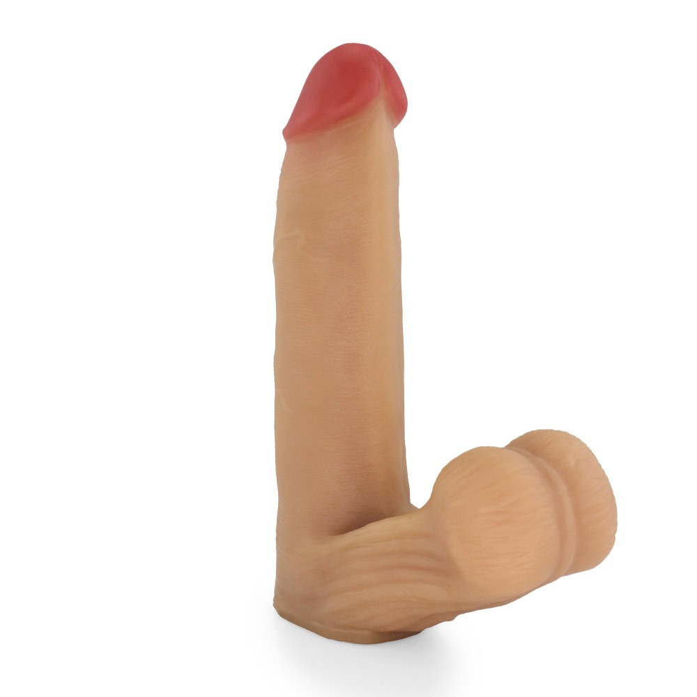 P�nis Real�stico com Escroto Mamba em foto de perfil, mostrando o comprimento e a curvatura natural.