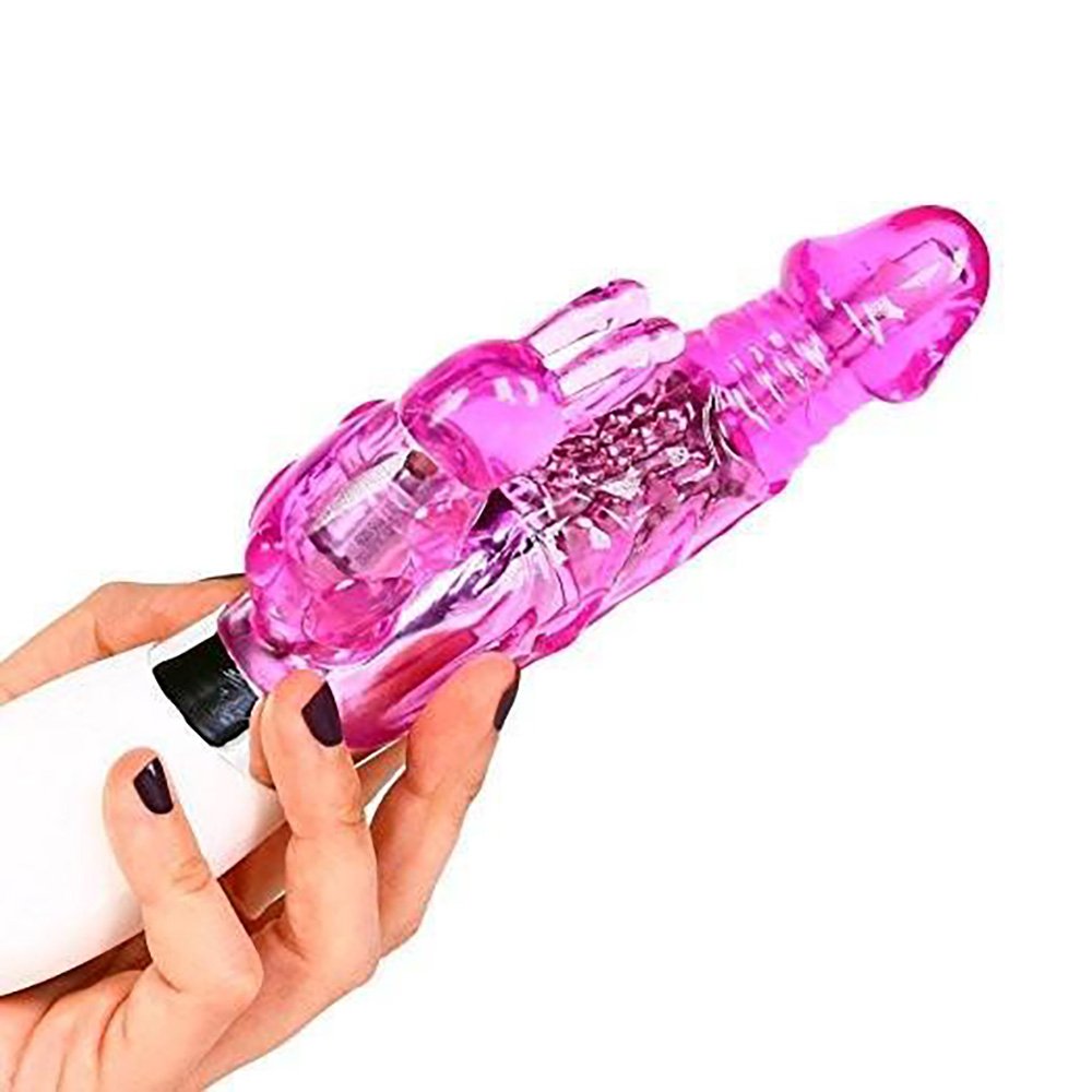 Vibrador Rabbit Rotativo Haloy com 6 Modos de Vibra��o e Rota��o Pink - Sendo segurado por uma m�o feminina, mostrando a propor��o e o conforto de manuseio