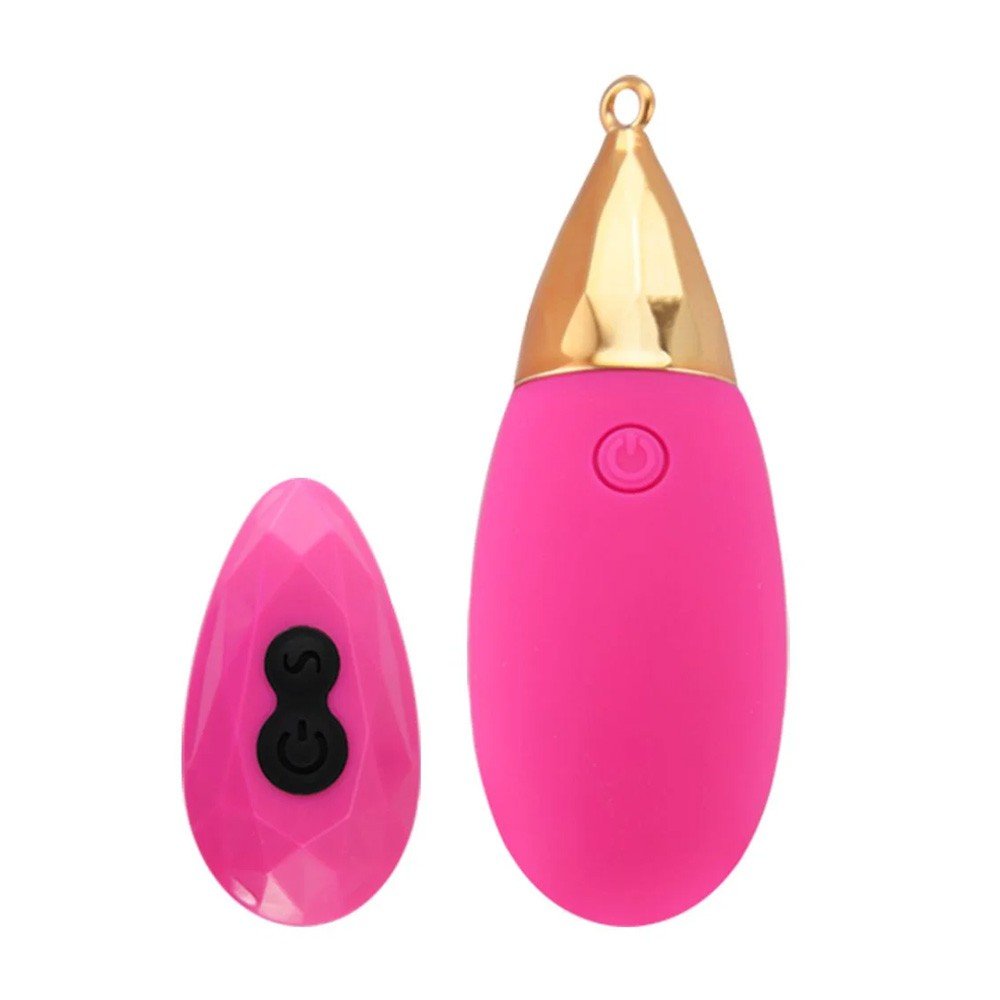 Vibrador em formato de gota com detalhes dourados e controle remoto pink com superf�cie facetada.