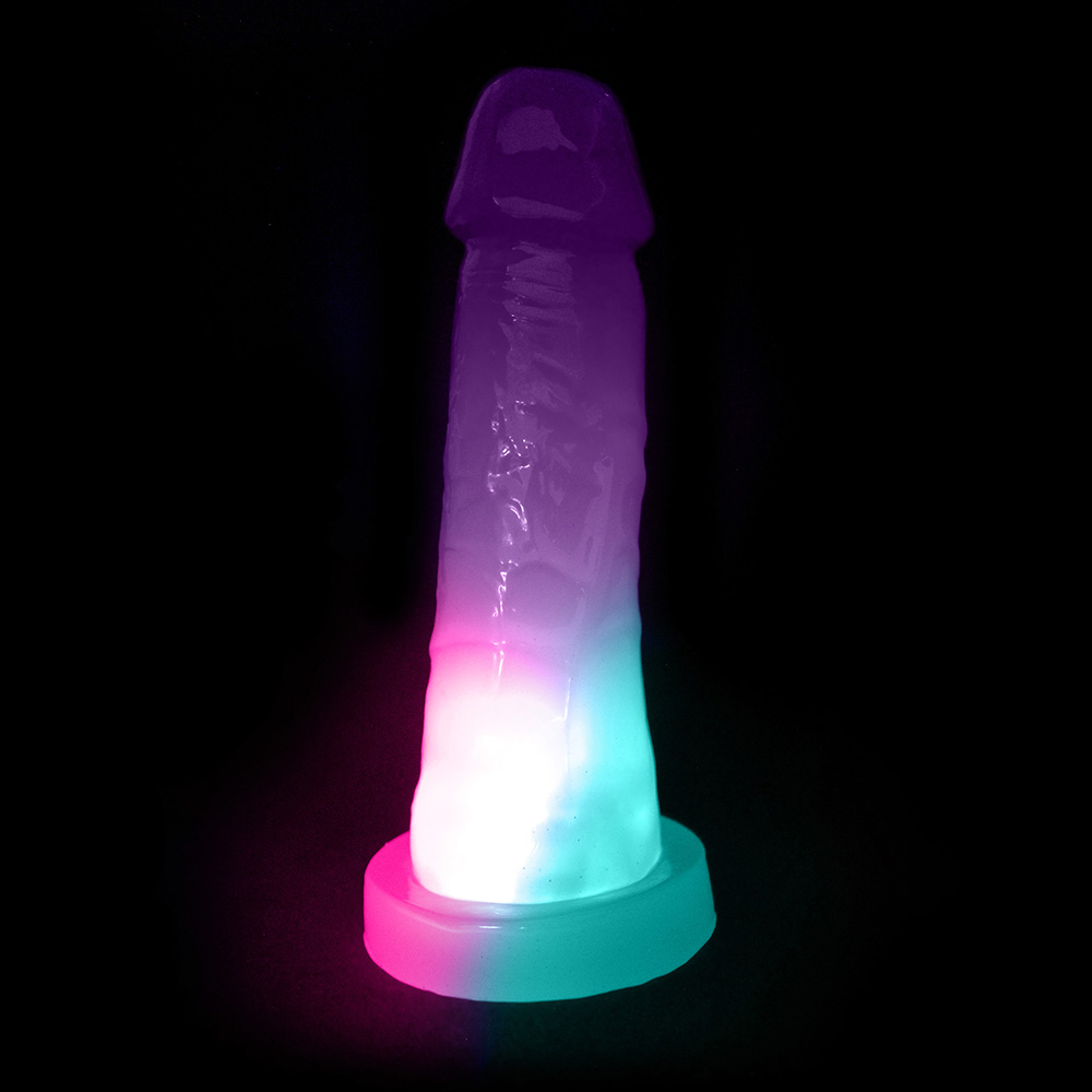 P�nis Pisca Pisca Mi�rcoles com Base para Cinta Transl�cido Roxo, iluminado e em �ngulo frontal.