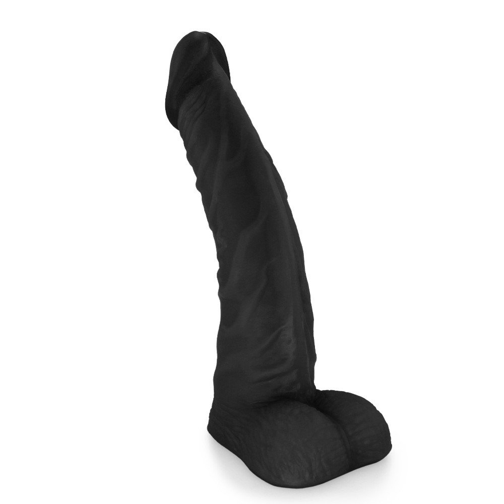P�nis de Borracha com Escroto Poseidon | Vista lateral superior, mostrando o perfil e a ponta do dildo. Cor preta.