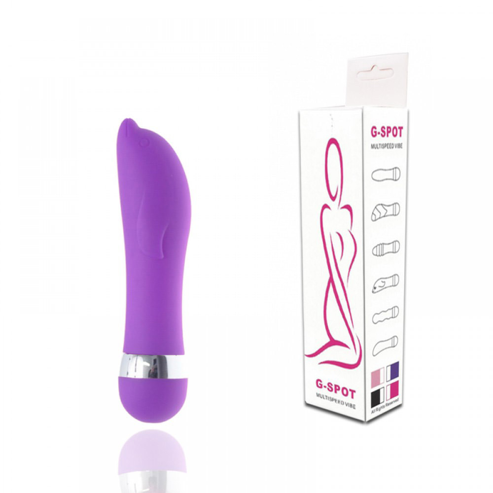 Vibrador para Clit�ris em Formato de Golfinho Roxo - Produto ao lado de sua embalagem, mostrando o tamanho e a apresenta��o