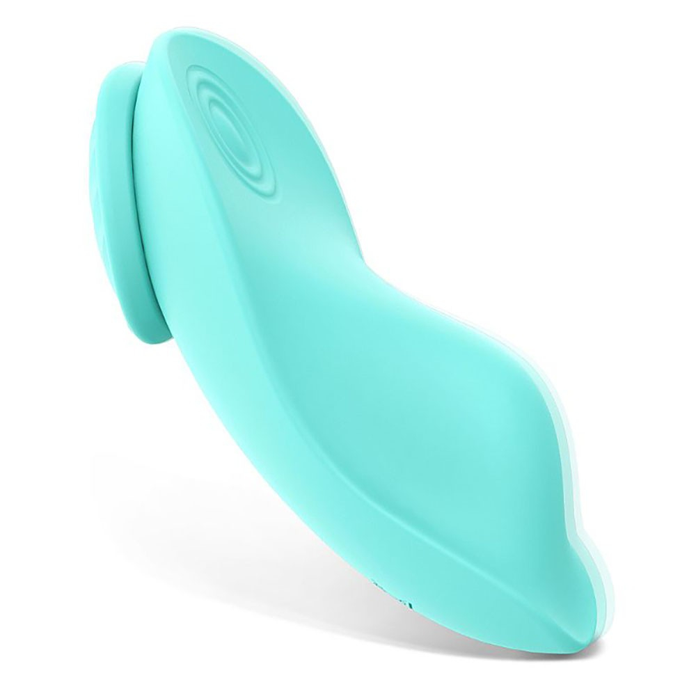 Vibrador Leaf Cyan em uso com calcinha e controle, vista macro