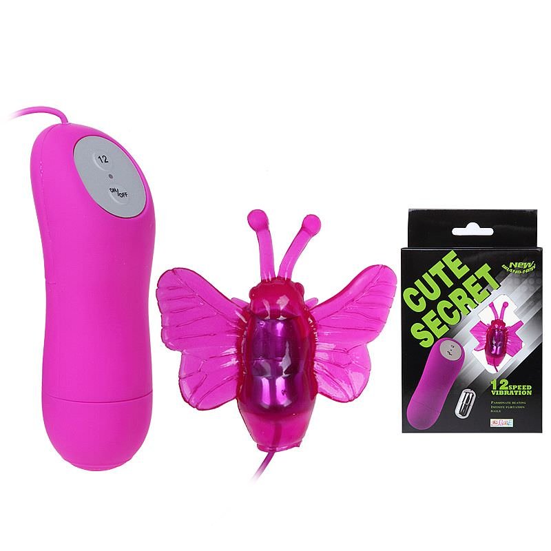 Vista do Vibrador Bullet Roxo e da Borboleta, ao lado da embalagem do produto. A embalagem e na cor roxa, dando mais detalhes sobre o produto.