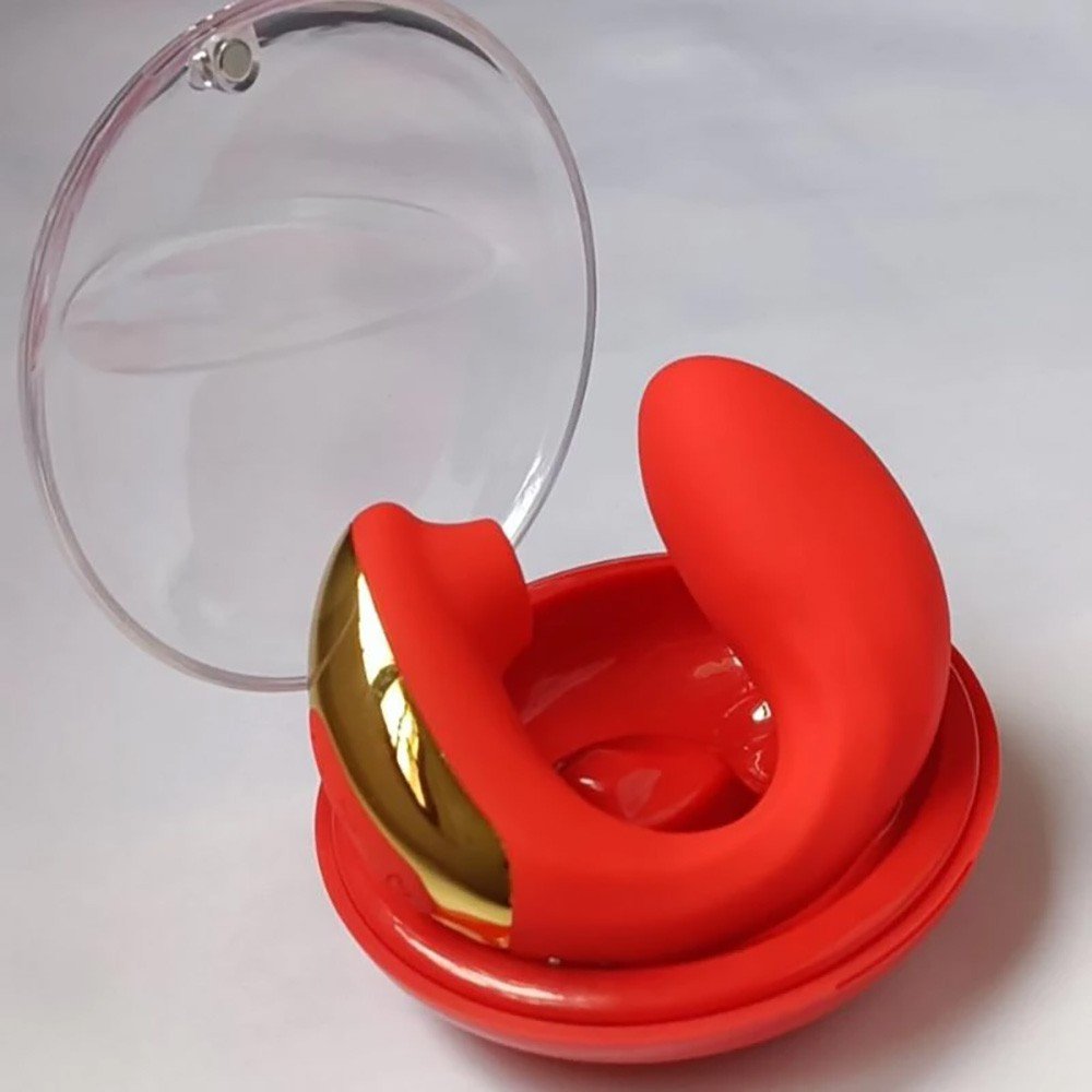 Sugador de Clit�ris e Vibrador para Ponto G Recarreg�vel Ivy em seu estojo aberto, mostrando o vibrador vermelho e a caixa transparente