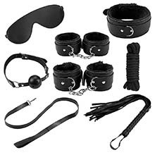 Foto do Produto Kit Bondage com 7 Itens: Venda, Morda�a, Algema, Tornozeleira, Corda, Flogger e Coleira Preto